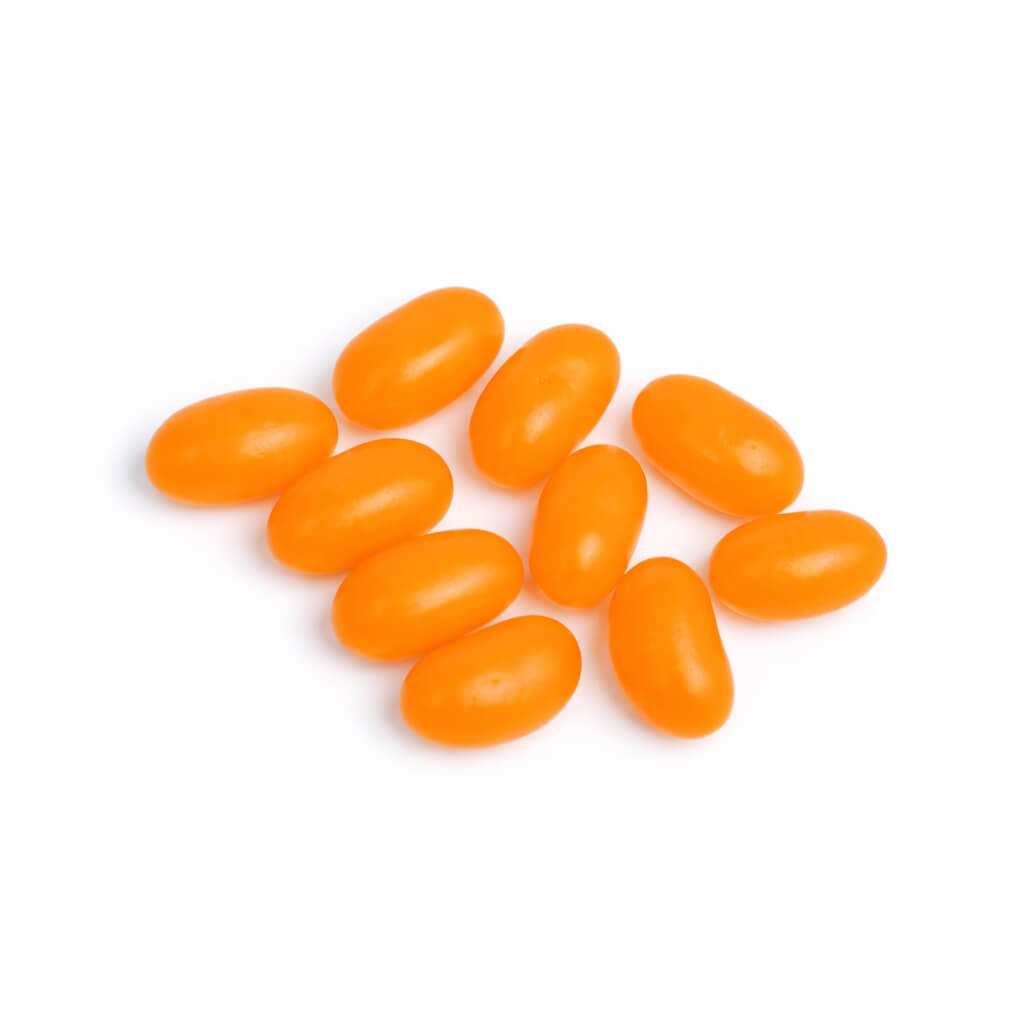 orange jelly beans on a white background