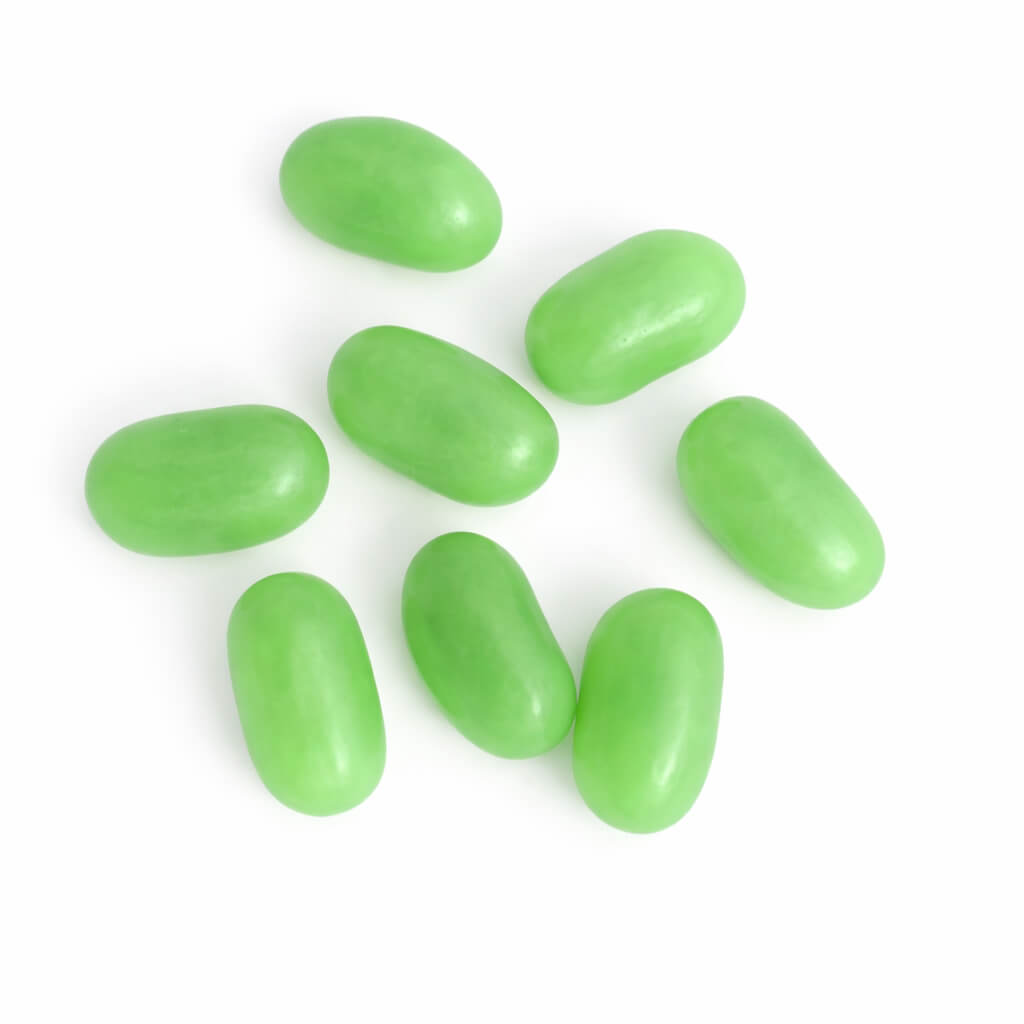 green jelly beans on a white background