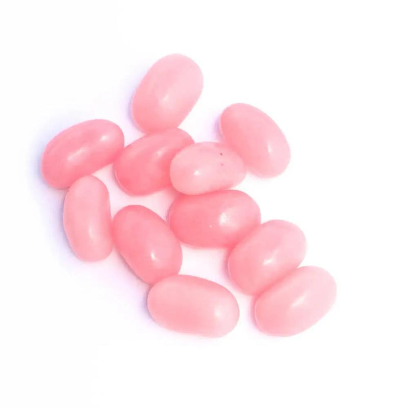 A handful of baby pink coloured jelly bean lollies