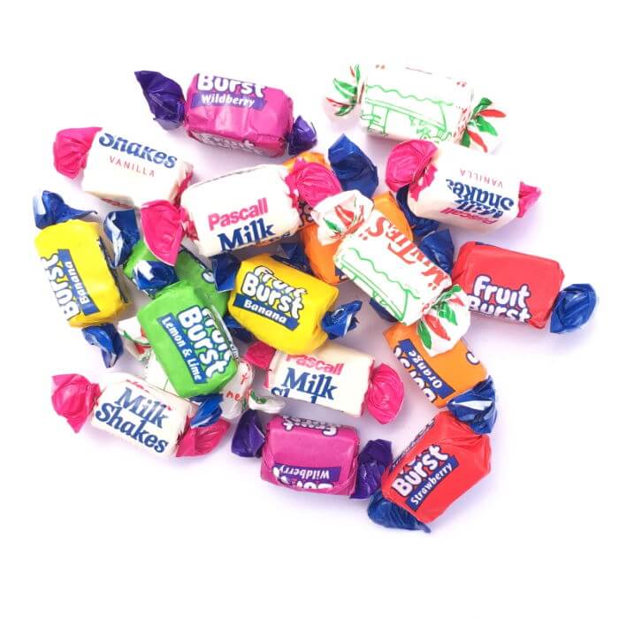 A pile of Pascalls Fruit Burst, Minties and Milkshakes Chews